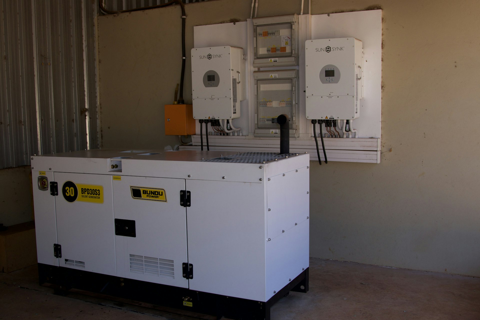 Inverter not charging: checking the inverter display and battery cables in a Lagos home